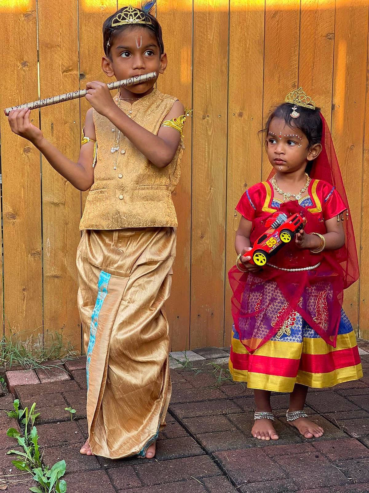 Nethran is registered to the contest to win money with this photo: adaptation, child, clothing, door, dress, event, eye, face, fun, happy, hat, head, headgear, jewellery, magenta, people, person, plant, smile, toddler