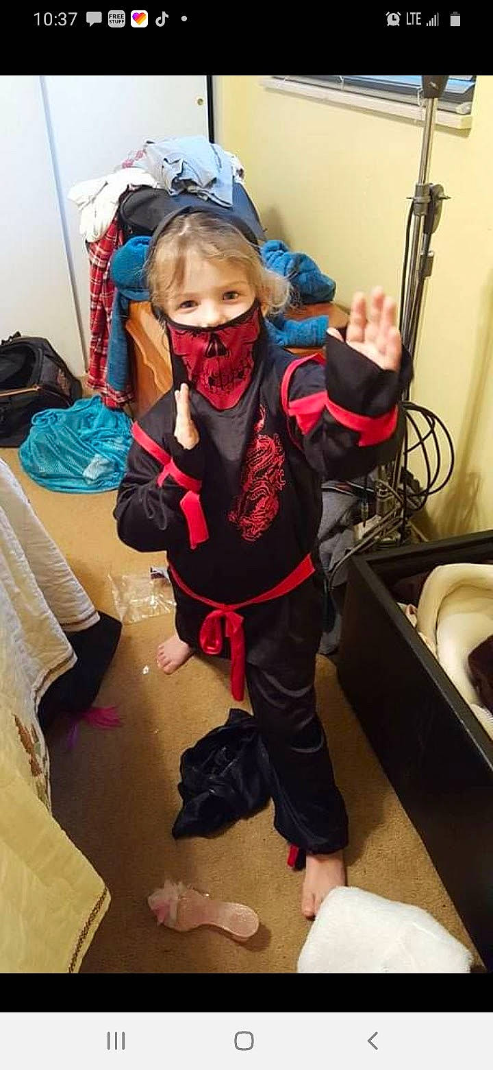 Ashley is registered to the contest to win money with this photo: adventure, audio_equipment, backpack, bag, baggage, carmine, child, costume, electric_blue, eyewear, fictional_character, flooring, fun, helmet, luggage_and_bags, person, personal_protective_equipment, room, selfie, toddler