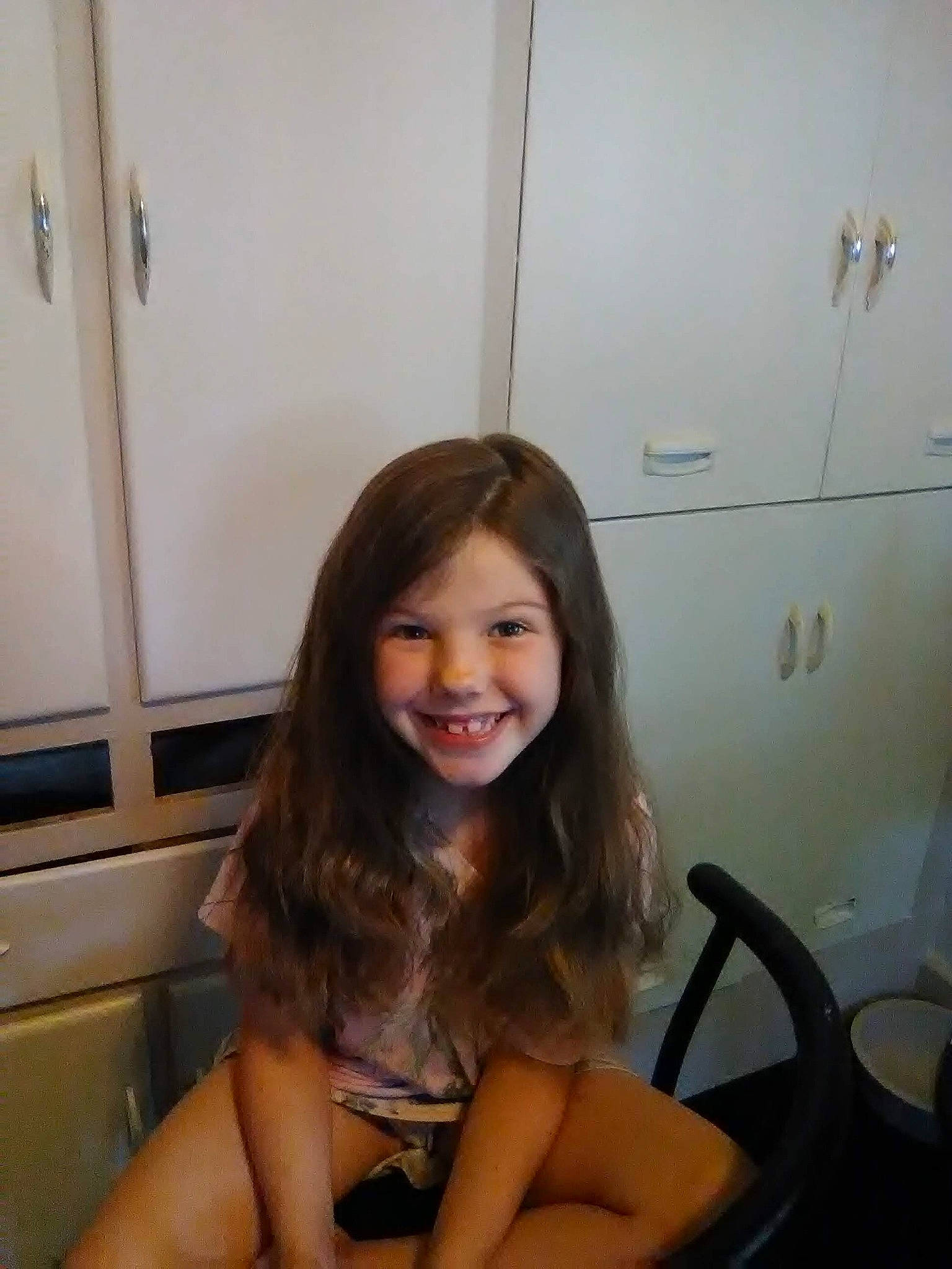 Ashley is registered to the contest to win money with this photo: blond, brown_hair, chair, child, fun, happy, human_leg, joy, laugh, leisure, long_hair, person, room, sitting, smile, thigh, toddler, vehicle_door