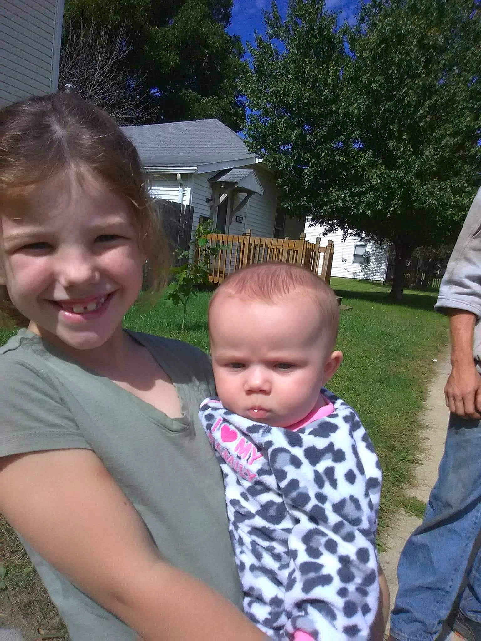 Ashley joined the competition — help win amazing prizes! baby, blue, child, event, fun, garden, grass, happy, iris, joy, lawn, leisure, person, plant, recreation, sitting, smile, t_shirt, toddler, tree