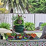 toddler, child, costume, caterpillar, table, tablecloth, polka_dot, felt, crafts, greenery, plants, outdoor, garden, cute, smiling, person, hat, playful, decorations, seated