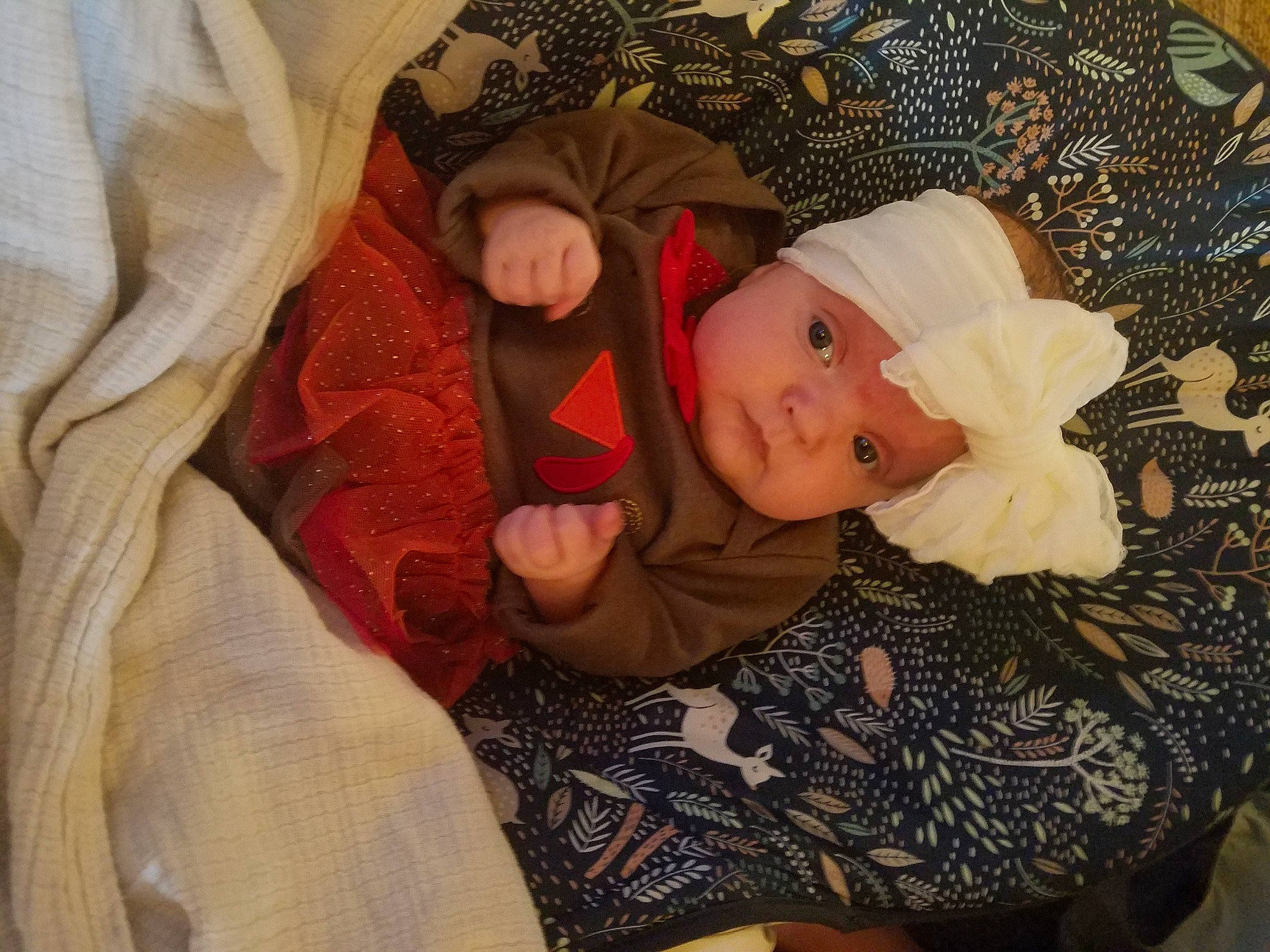 Maliyah joined the competition — help win amazing prizes! baby, baby_toddler_clothing, cheek, child, comfort, eye, hat, head, headwear, lap, linens, pattern, person, room, sitting, sleeve, textile, toddler, wood, wool