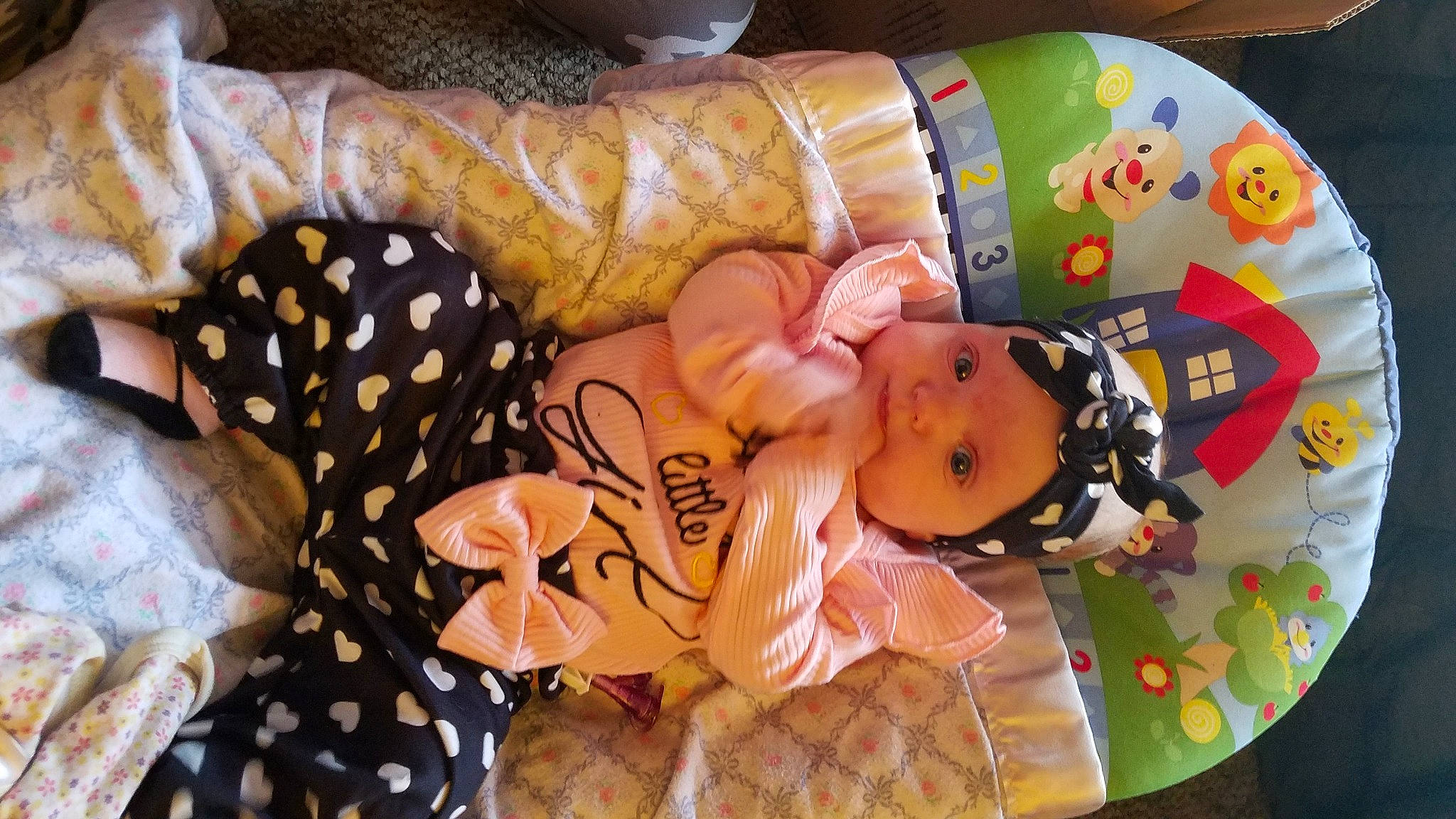 Maliyah joined the competition — help win amazing prizes! baby, baby_products, baby_toddler_clothing, child, comfort, event, headwear, linens, orange, pattern, peach, person, room, textile, toddler