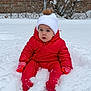 toddler, child, snow, winter, red_snowsuit, mittens, hat, pom_pom, outdoor, cold_weather, snowy_ground, fence, bare_branches, winter_clothing, sitting, young_child, face, expression, nature, daytime