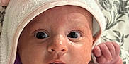 Sienna is registered to the contest to win money with this photo: baby, infant, face, eyes, skin, towel, hood, butterfly, pink, soft, blanket, pattern, closeup, newborn, cute, expression, portrait, person, child, indoors