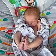 Xavier joined the competition — help win amazing prizes! newborn, baby, sleeping, blanket, infant, child, cute, wrapped, baby_seat, cartoon_animals, elephant, monkey, colorful, soft, peaceful, indoors, portrait, feet, head, resting