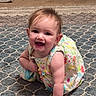 Lilith joined the competition — help win amazing prizes! baby, child, crawling, smiling, dress, colorful, carpet, patterned, indoor, floor, happy, cute, person, infant, young_child, playful, skin, hand, head, hair