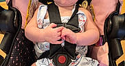 Lilith joined the competition — help win amazing prizes! baby, black, book, car_seat, child, clothing, cute, expression, face, hair, hands, indoor, infant, pink, playful, portrait, seat_belt, sitting, toy, young_child
