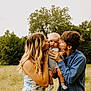baby, child, young_adult, family, kissing, outdoor, meadow, flowers, trees, nature, love, affection, portrait, summer, grass, casual_clothing, happy, holding, people, daylight
