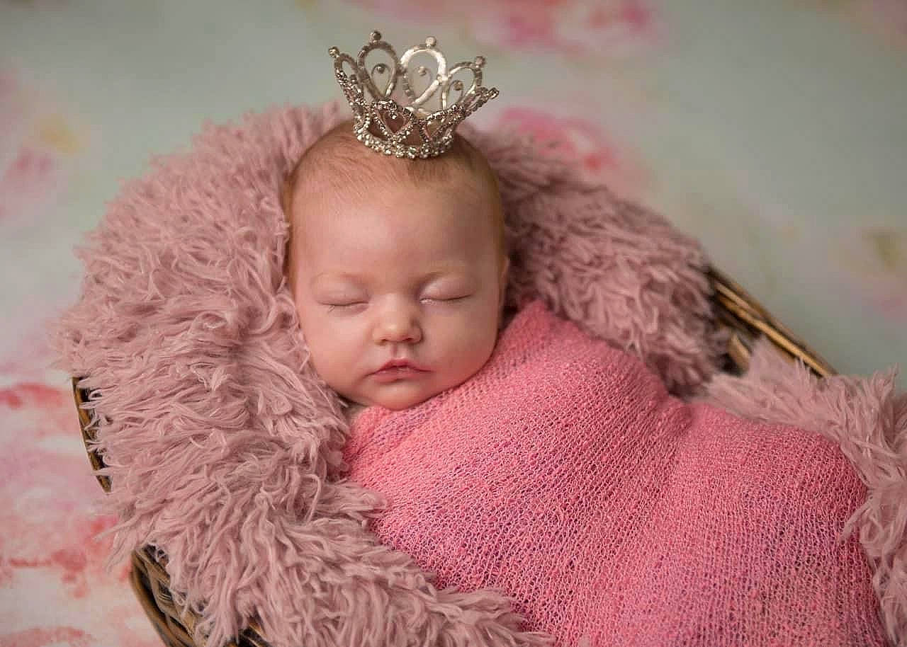 Misty is registered to the contest to win money with this photo: baby, baby_toddler_clothing, cap, child, comfort, costume_hat, crown, fur, hair_accessory, happy, head, headgear, headpiece, jewellery, knit_cap, linens, magenta, person, pink, tiara
