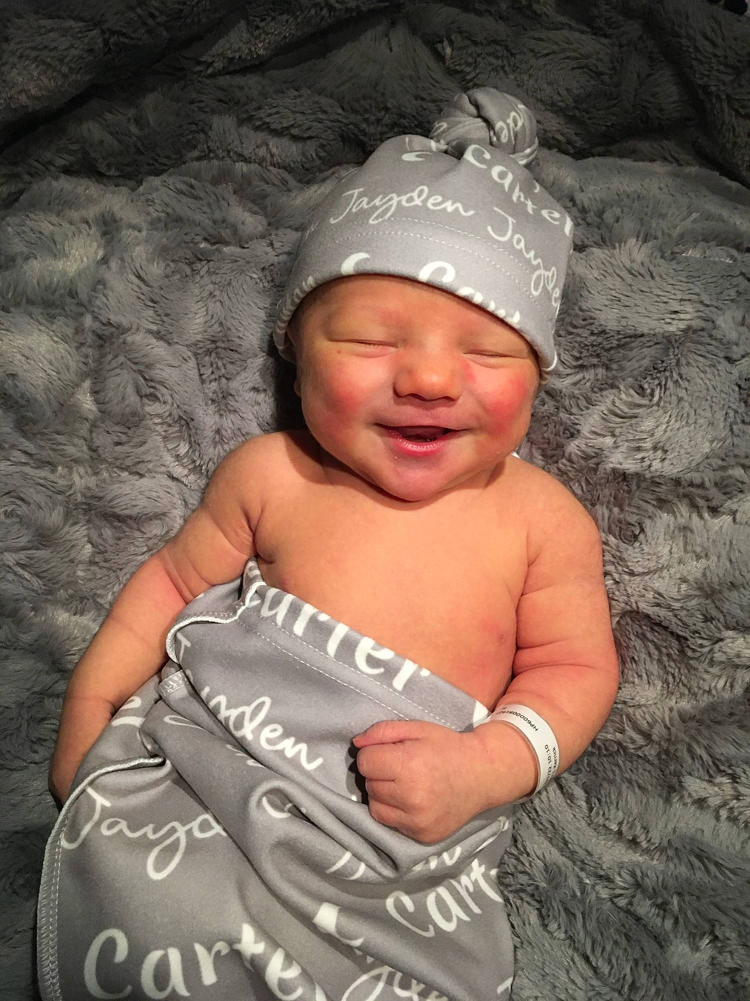 Carter is registered to the contest to win money with this photo: baby, baby_toddler_clothing, cap, child, costume_hat, dress, event, fashion_accessory, flash_photography, fun, gesture, grass, happy, headwear, pattern, person, portrait_photography, skin, smile, textile