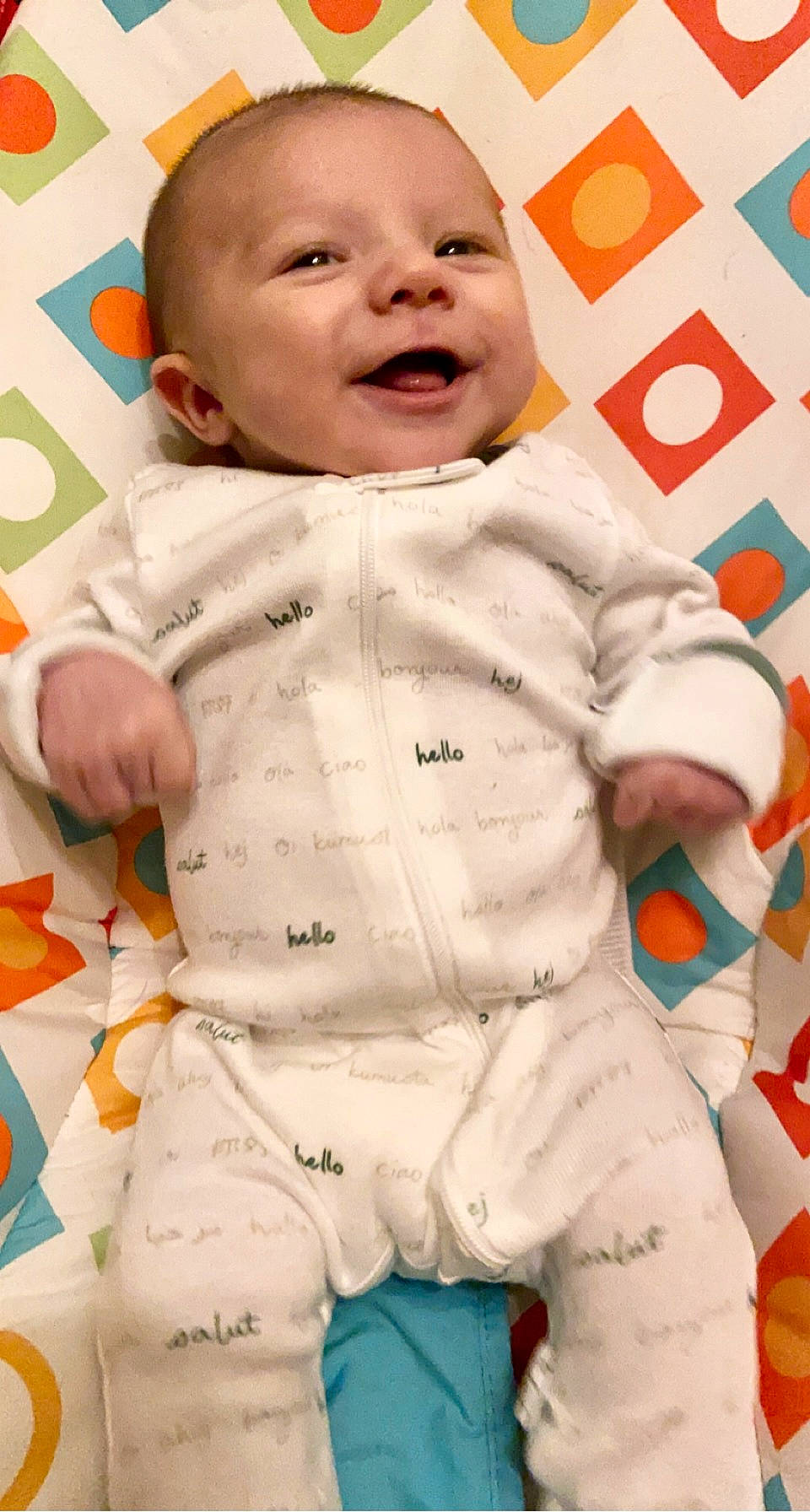 Carter is registered to the contest to win money with this photo: baby, baby_toddler_clothing, cheek, clothing, collar, comfort, face, facial_expression, happy, head, linens, nose, orange, outerwear, person, photograph, skin, sleeve, smile, toddler