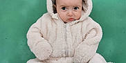 Colin participe au concours pour gagner de l'argent avec cette photo : baby, child, fur_suit, hood, green_background, cute, expression, sitting, portrait, winter_clothing, zipper, face, eyes, hands, feet, infant, warm, cozy, one_person, indoors