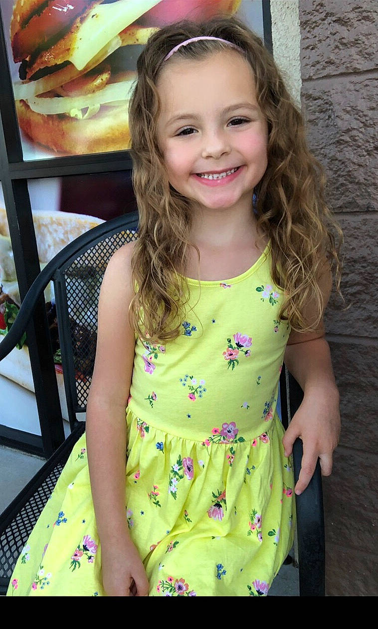 Avi is registered to the contest to win money with this photo: child, child_model, clothing, dress, joy, long_hair, neck, pattern, person, sleeve, smile, summer, toddler, yellow