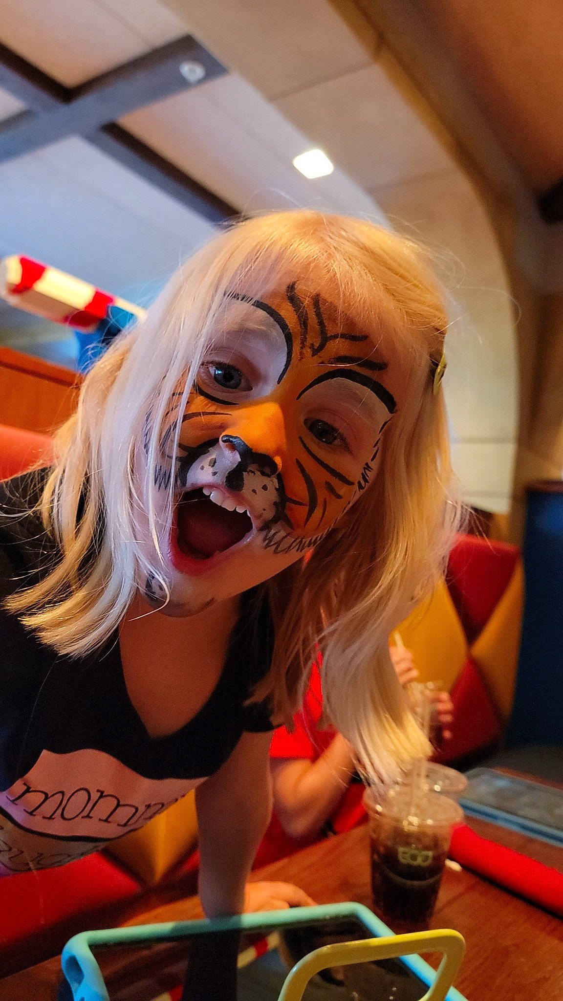 Harlow is registered to the contest to win money with this photo: animated_cartoon, beard, blond, child, entertainment, event, eyewear, fiction, fictional_character, fun, games, hair_coloring, happy, long_hair, mouth, orange, person, personal_protective_equipment, recreation, tableware