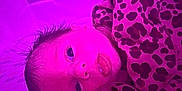 Alessia is registered to the contest to win money with this photo: baby, newborn, infant, face, blanket, leopard_print, hair, lying_down, purple_light, pink_light, cute, wrapped, portrait, indoors, child, young, looking, skin, expression, soft