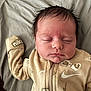baby, sleeping, infant, face, hair, clothing, nike, onesie, blanket, bed, peaceful, soft, cute, young_child, portrait, skin, closeup, resting, indoors, child