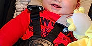 Scott joined the competition — help win amazing prizes! baby, car_seat, child, clothing, comfort, cute, face, happy, harness, indoors, infant, person, plush_toy, portrait, red_hair, red_shirt, seatbelt, smiling, soft_toy, yellow_blanket