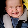 baby, smiling, face, child, car_seat, safety_harness, blue_clothing, yellow_blanket, happy, cute, infant, cheeks, tongue, closeup, portrait, young_child, seatbelt, baby_boy, joyful, cozy