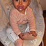 baby, pacifier, bouncer, pink_clothing, white_pants, baby_shoes, indoor, red_eye, cute, child, infant, seat, floor_tiles, cozy, curious, hands, face, head, sitting, portrait