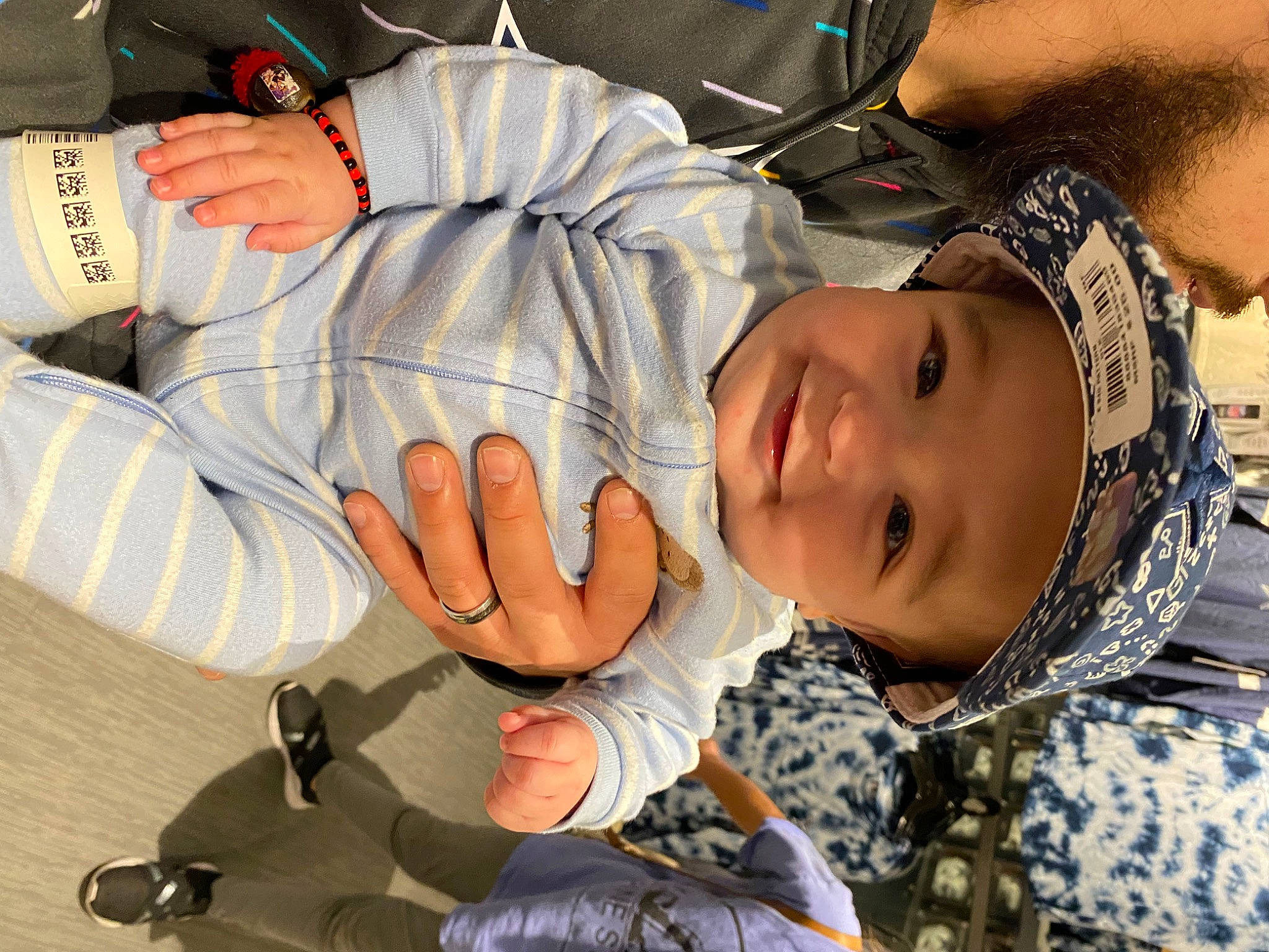 Maddox is registered to the contest to win money with this photo: child, comfort, cool, elbow, eyelash, finger, fun, gesture, happy, headwear, human_body, joint, joy, mouth, nail, pattern, person, sitting, smile, thumb