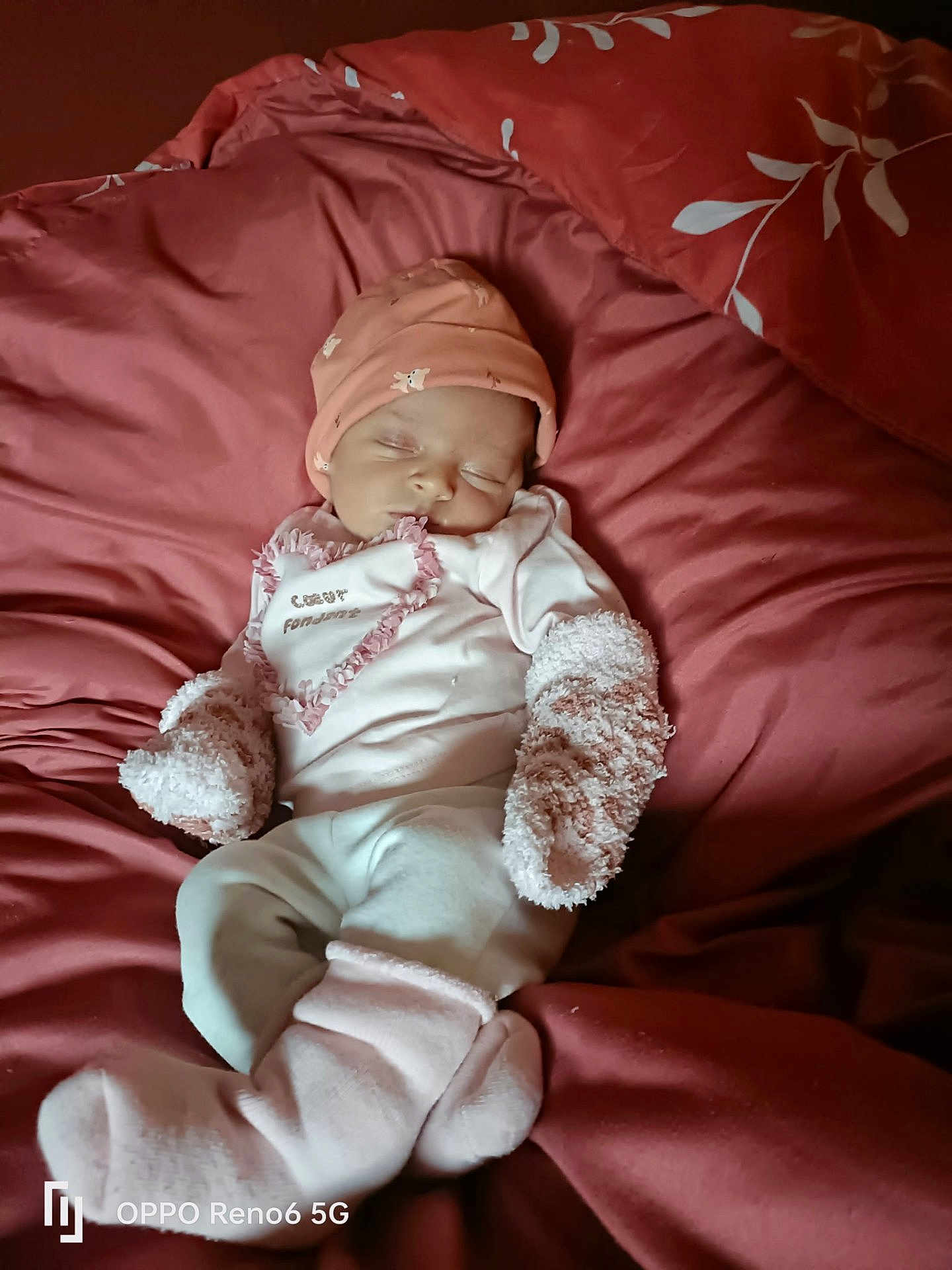 Emi participe au concours pour gagner de l'argent avec cette photo : baby, sleeping, blanket, mittens, socks, hat, infant, cozy, soft, bed, resting, cute, person, child, warm, pink, clothing, comfort, portrait, indoors
