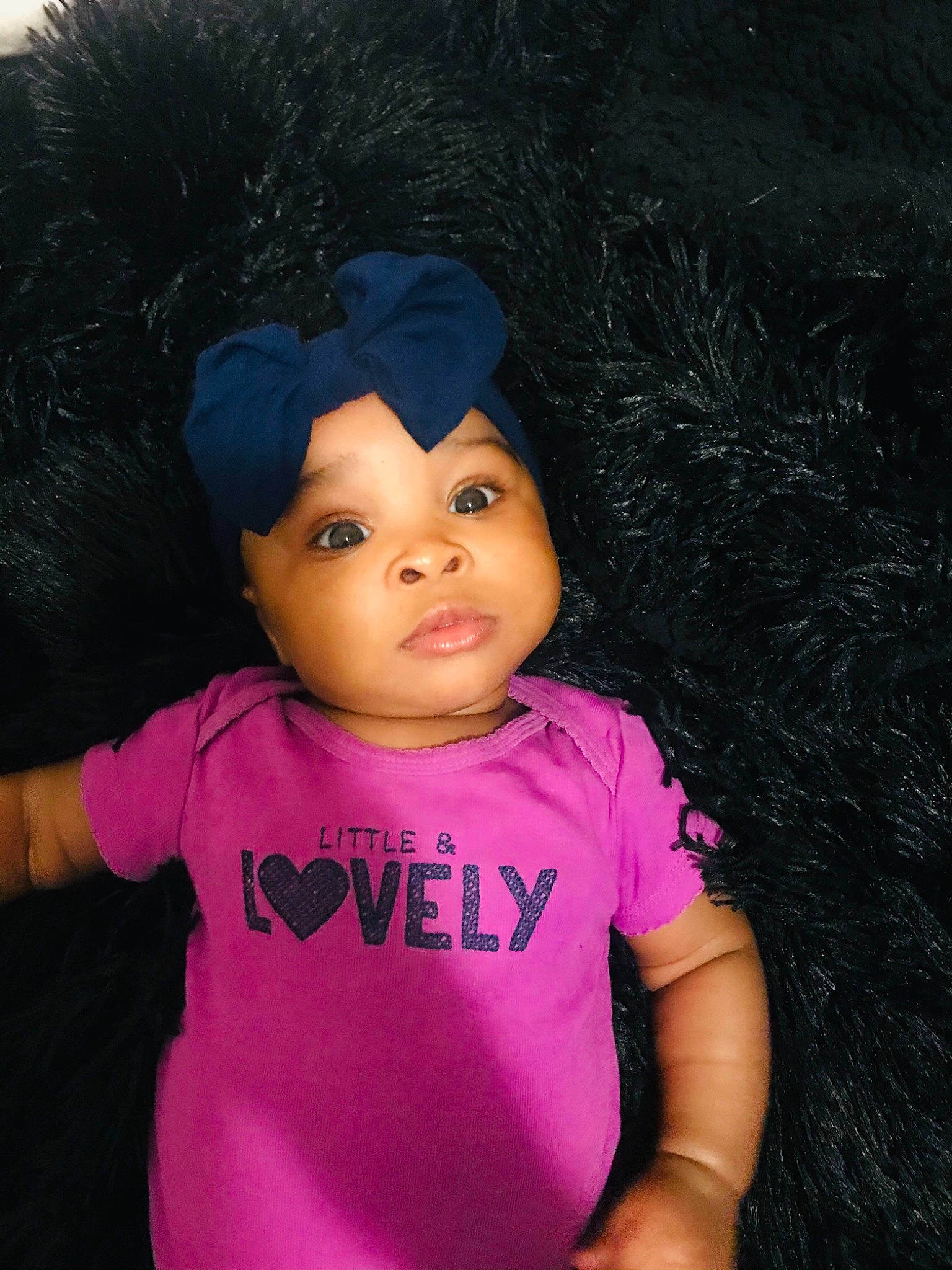 Ilani is registered to the contest to win money with this photo: active_shirt, baby, baby_toddler_clothing, cheek, child, cool, costume_accessory, headwear, magenta, person, pink, skin, sleeve, toddler