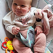 Catalyna participe au concours pour gagner de l'argent avec cette photo : baby, infant, smiling, cute, cushion, baby_seat, soft_toy, rattle, clothing, pink_pants, white_sweater, face, hand, foot, indoors, child, happy, portrait, cozy, cute_expression