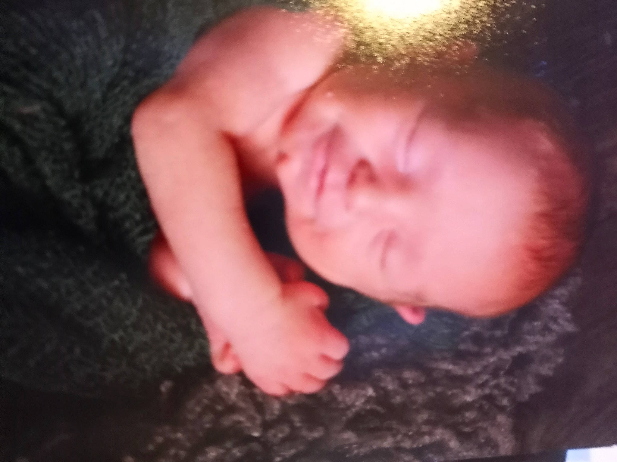 Griffin is registered to the contest to win money with this photo: arm, baby, beard, chest, comfort, elbow, eye, eyebrow, eyelash, finger, flash_photography, gesture, grass, happy, human_body, jaw, nail, nose, person, thumb