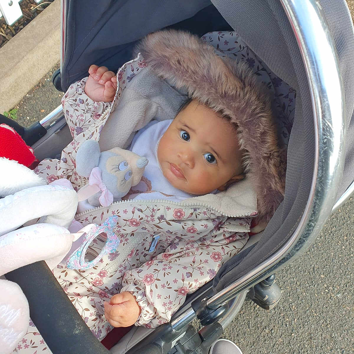 Alyssia joined the competition — help win amazing prizes! accessories, baby, bed, bonnet, clothing, coat, face, furniture, hat, head, jacket, newborn, person, photography, portrait, sleeping, stroller, sunglasses, tape, toy