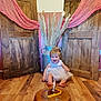 baby, child, birthday, cake, candle, dress, floor, wood, doors, fabric, pink, vase, pampas_grass, smile, happy, celebration, indoor, rustic, metal, cute