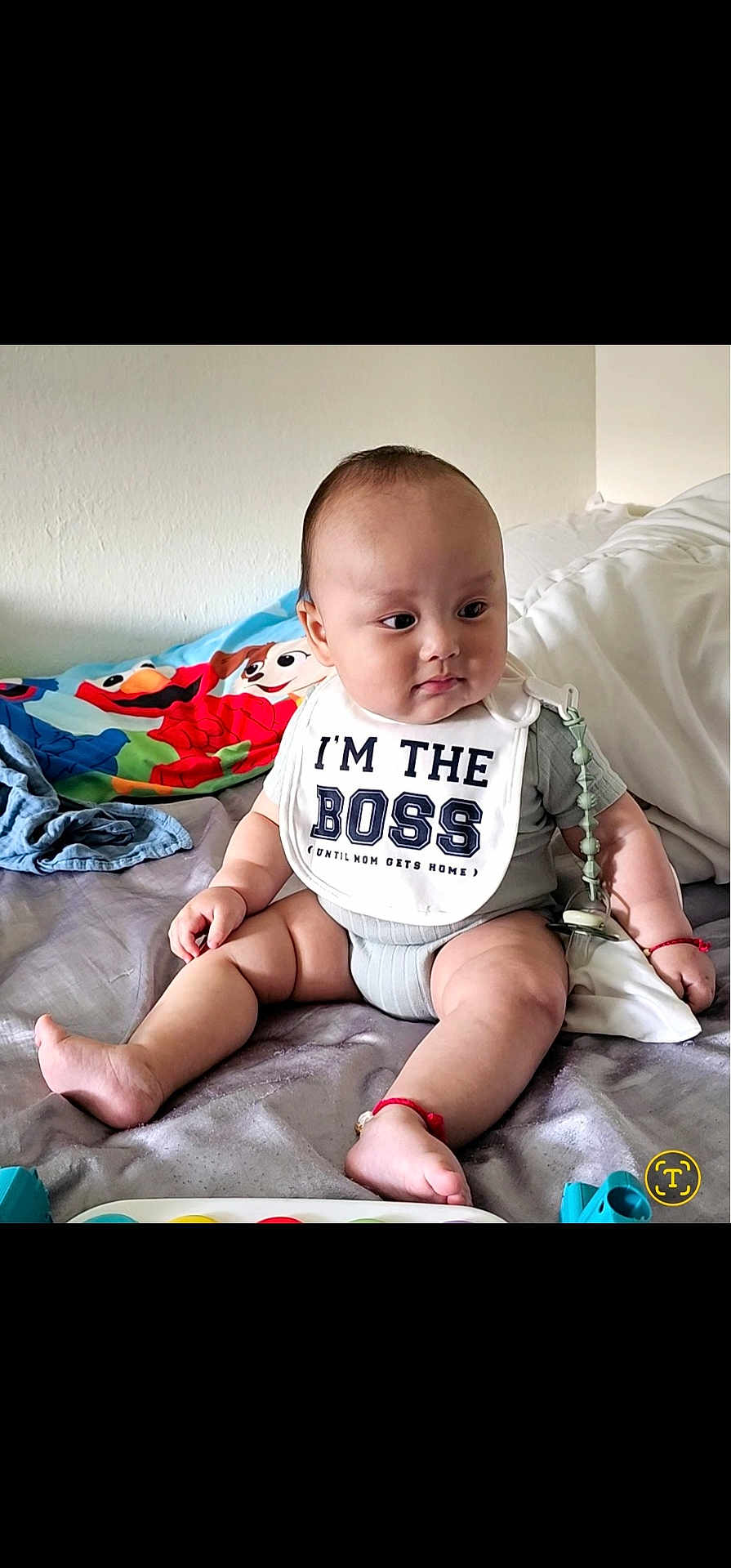 Felix Yang joined the competition — help win amazing prizes! baby, infant, child, sitting, bib, clothing, bed, blanket, toy, indoors, cute, chubby, expression, person, playful, colorful, smile, head, skin, young