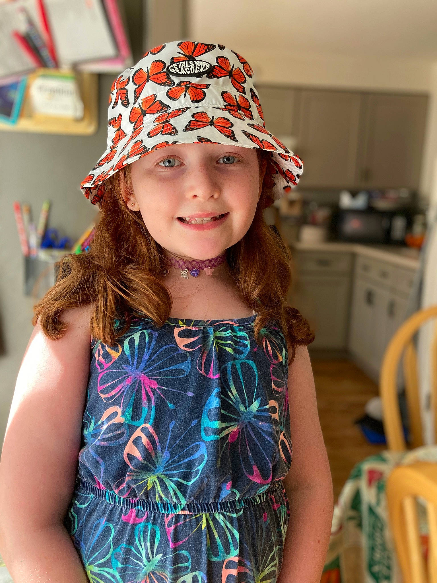 Amanda is registered to the contest to win money with this photo: cap, chair, child, clothing, cool, costume_hat, face, fashion, hair, hairstyle, happy, hat, head, headgear, headwear, helmet, joy, neck, person, sleeve
