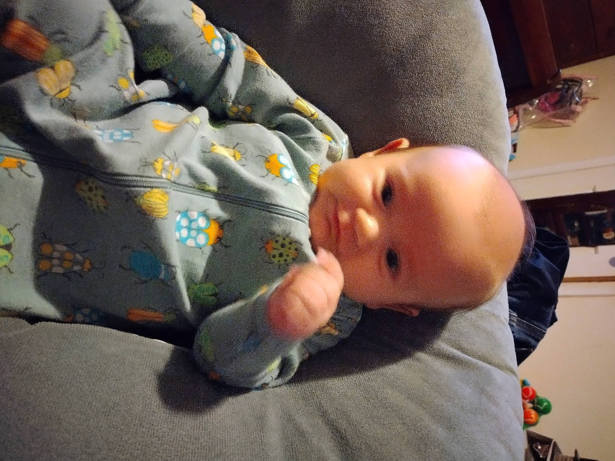 Evander is registered to the contest to win money with this photo: arm, baby, baby_products, baby_toddler_clothing, bedtime, cheek, child, comfort, elbow, finger, foot, gesture, linens, nail, nap, person, room, sitting, sleep, thumb