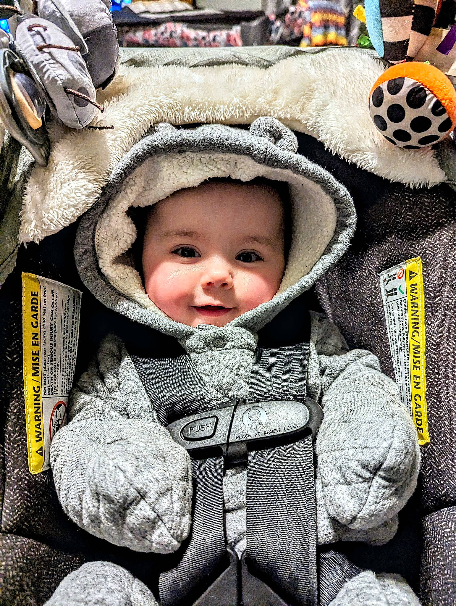 Lily joined the competition — help win amazing prizes! baby, baby_products, baby_toddler_clothing, cheek, child, comfort, eye, facial_expression, fun, grass, happy, headwear, hoodie, laugh, monochrome_photography, pattern, person, sitting, skin, smile