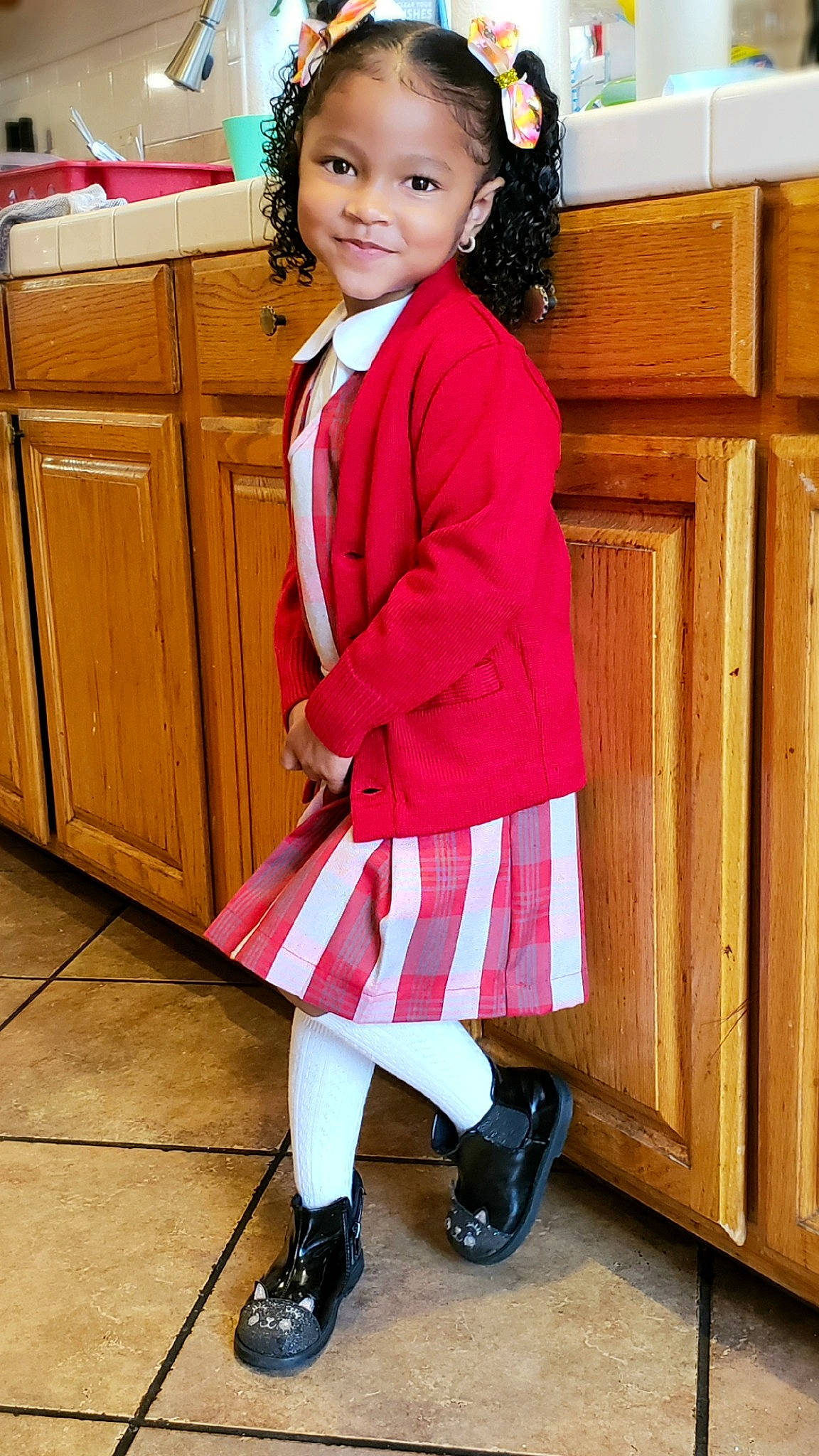 Faith joined the competition — help win amazing prizes! blazer, boot, cabinetry, child, clothing, event, fashion_design, formal_wear, hairstyle, joy, knee, leg, person, pink, shoe, sleeve, smile, sneakers, sock, tartan