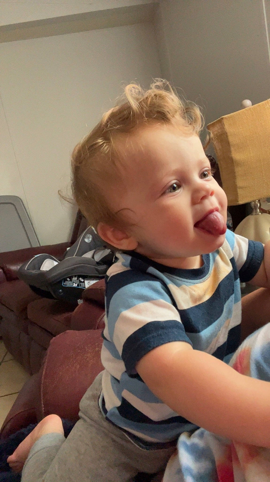 Waylon is registered to the contest to win money with this photo: baby, baby_toddler_clothing, blond, cheek, child, chin, comfort, ear, elbow, eyelash, face, hairstyle, happy, head, human_body, mouth, person, shoulder, sitting, skin