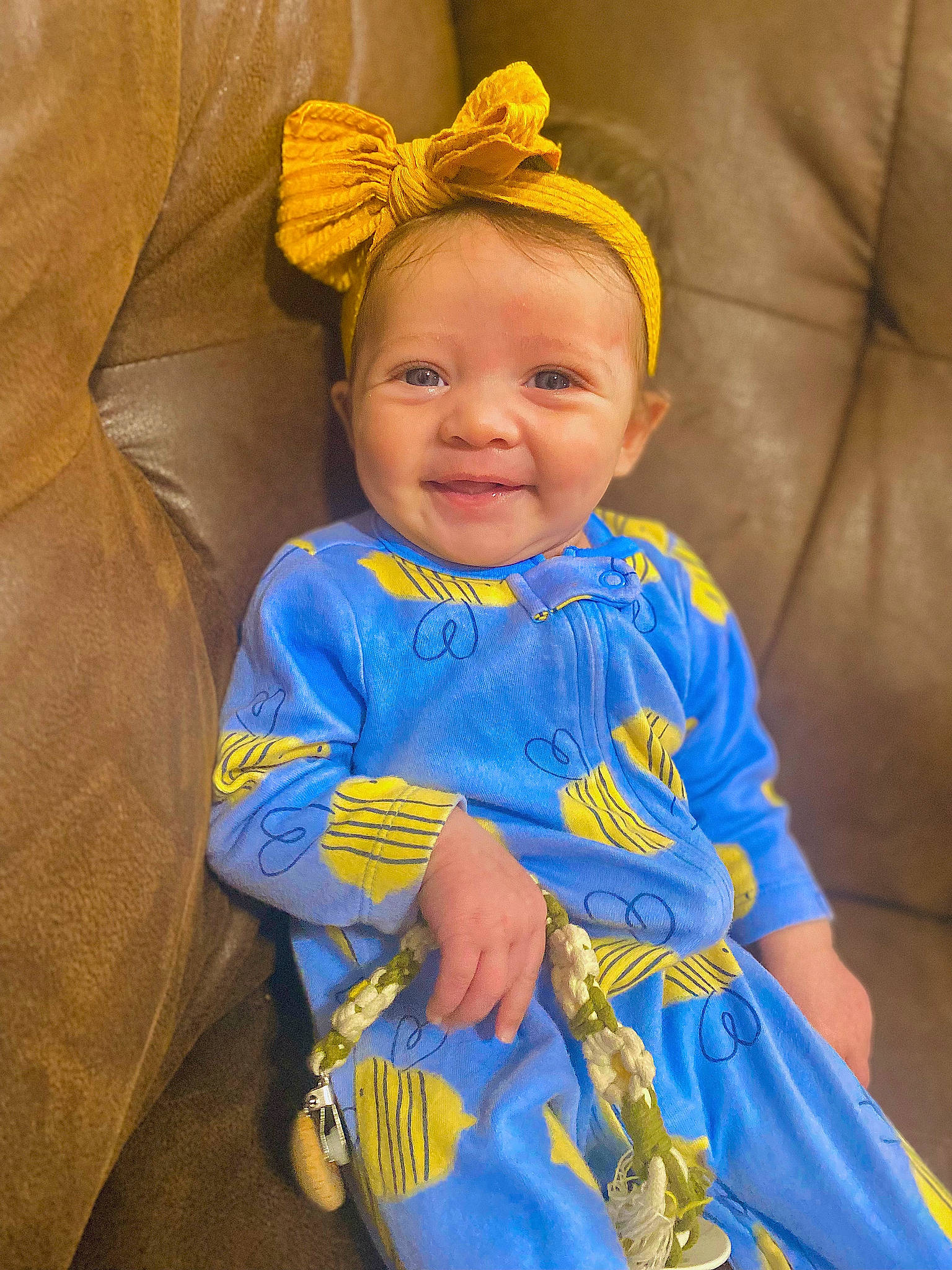 Lillianna is registered to the contest to win money with this photo: baby, baby_toddler_clothing, child, comfort, costume_hat, dress, electric_blue, event, eye, face, fun, happy, jewellery, joy, orange, person, skin, sleeve, smile, textile