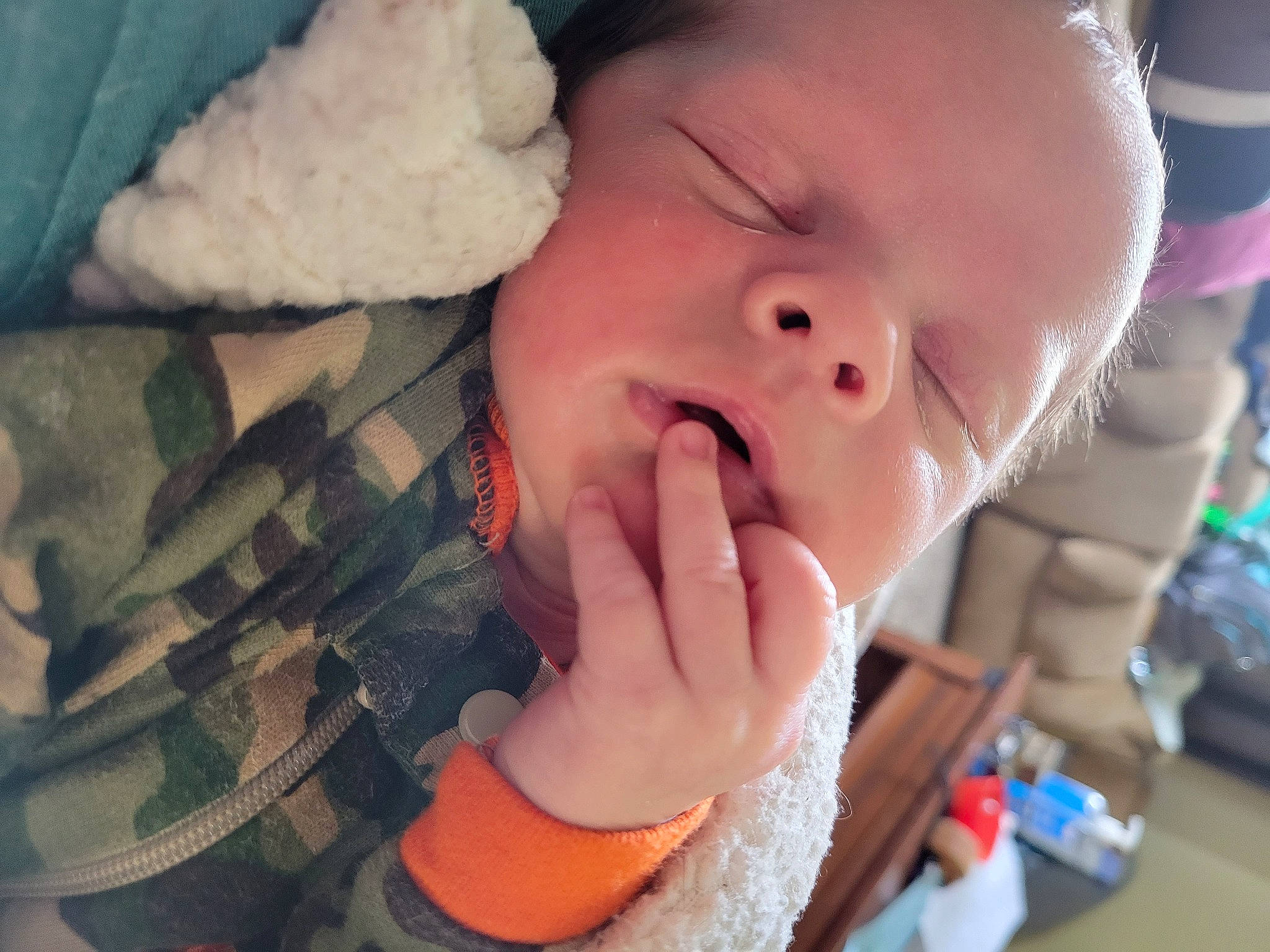 Colter is registered to the contest to win money with this photo: baby, baby_toddler_clothing, cheek, comfort, ear, eyebrow, eyelash, finger, gesture, happy, iris, lip, mouth, nail, neck, nose, person, skin, textile, thumb