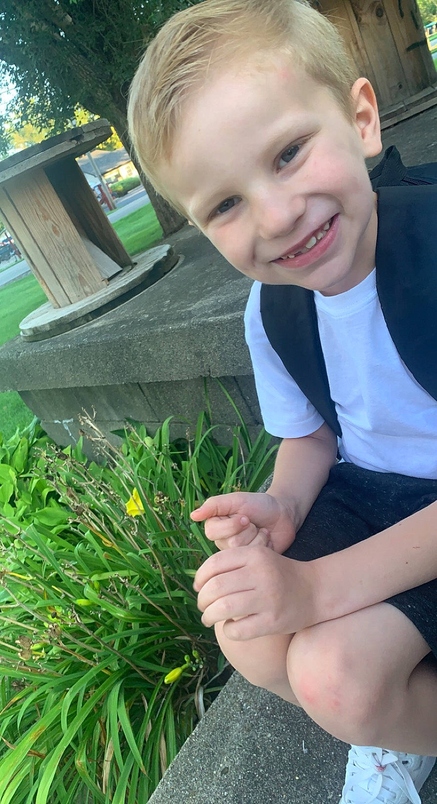 Cayden joined the competition — help win amazing prizes! facial_expression, finger, fun, grass, green, hairstyle, hand, happy, iris, joy, leg, leisure, organ, people_in_nature, person, photograph, plant, skin, smile, standing