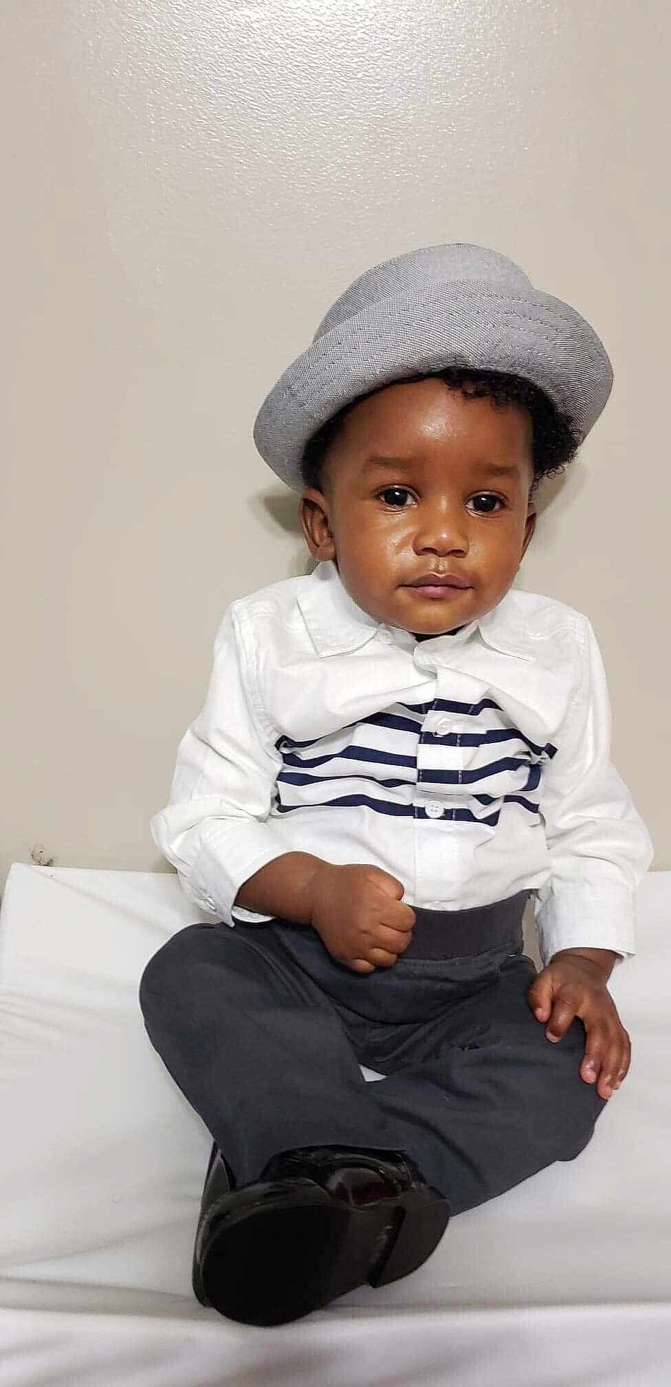 Nowah joined the competition — help win amazing prizes! baby, cap, child, child_model, hat, headgear, person, photography, sitting, sleeve, smile, toddler, white