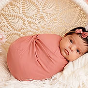 Aliyana joined the competition — help win amazing prizes! baby, infant, swaddle, pink, headband, bow, flower, cushion, basket, crochet, portrait, resting, cozy, soft, cute, child, newborn, peaceful, indoor, decor