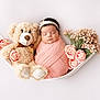 Aliyana is registered to the contest to win money with this photo: newborn, baby, teddy_bear, pink_blanket, flowers, hammock, sleeping, headband, cute, soft, portrait, infant, peaceful, child, toy, floral, decorative, wrapped, resting, adorable