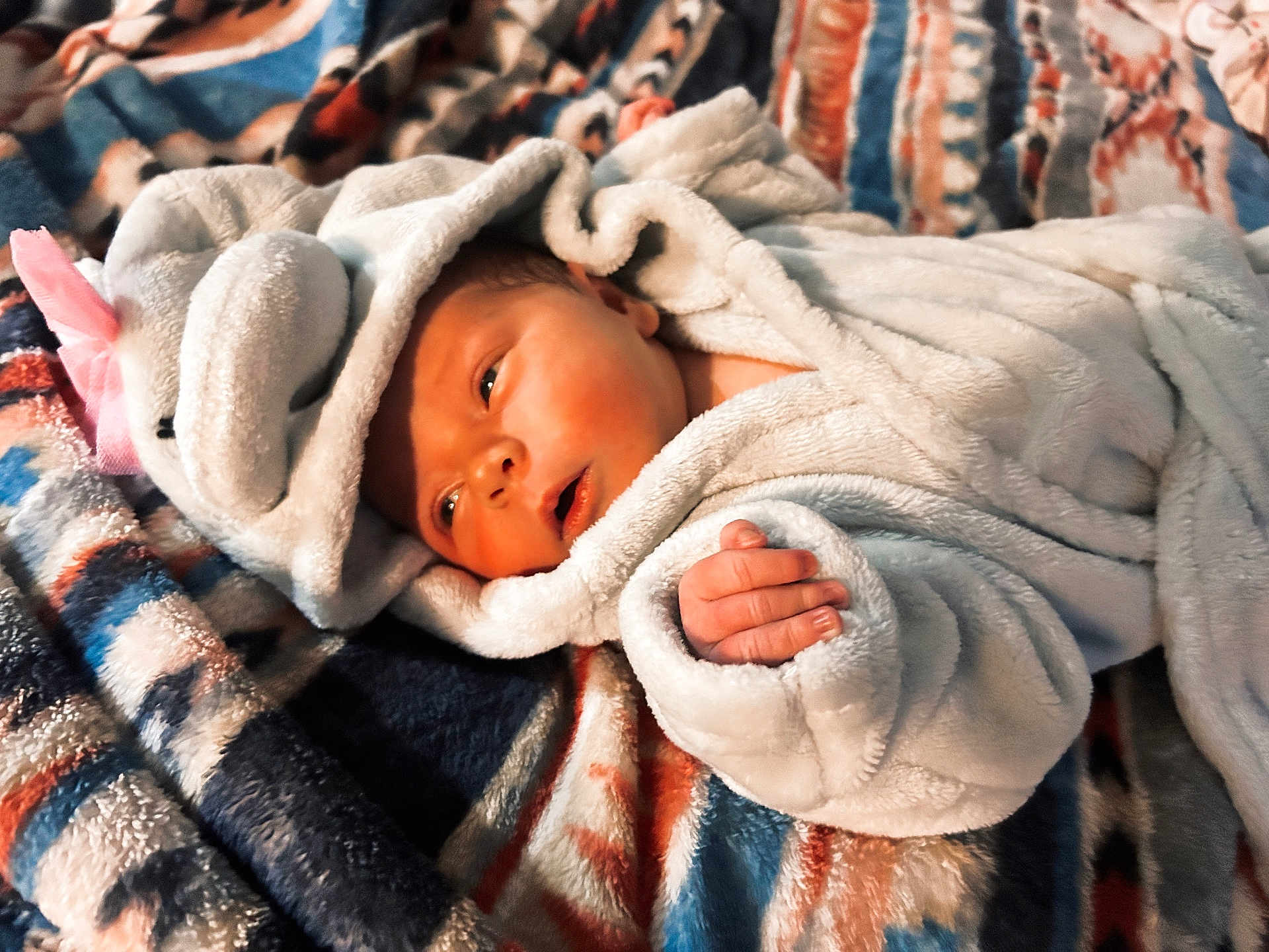 Sophia joined the competition — help win amazing prizes! newborn, baby, blanket, soft, cozy, wrapped, hooded_blanket, infant, sleepwear, patterned_blanket, cute, small_hand, face, portrait, lying_down, warm, comfort, child, indoor, resting