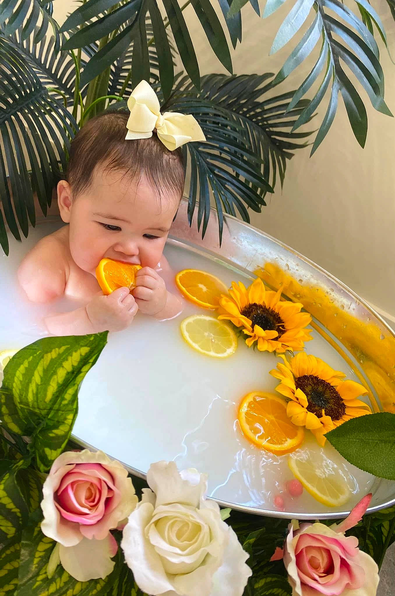 Kaylani joined the competition — help win amazing prizes! artificial_flower, baby, botany, bouquet, cut_flowers, floral_design, floristry, flower, flower_arranging, flowering_plant, happy, hybrid_tea_rose, orange, person, petal, plant, rose, serveware, tableware, toddler