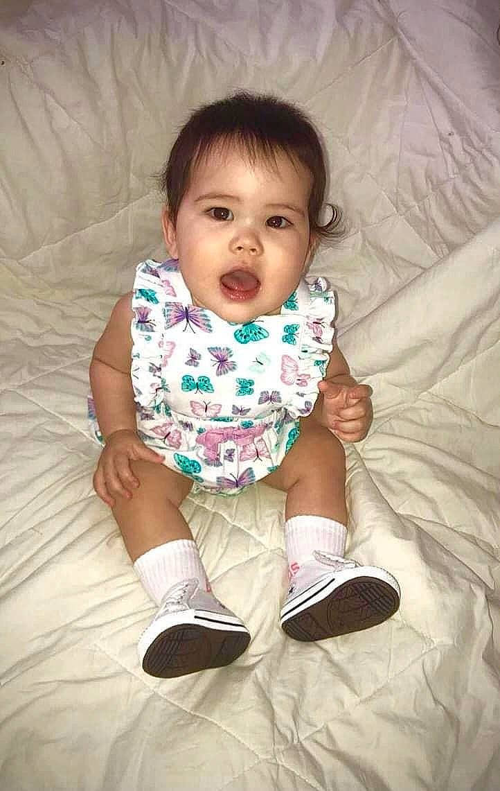 Kaylani joined the competition — help win amazing prizes! baby, baby_toddler_clothing, cheek, child, comfort, eye, finger, foot, fun, happy, human_leg, linens, pattern, person, sitting, skin, sleeve, sock, textile, thumb