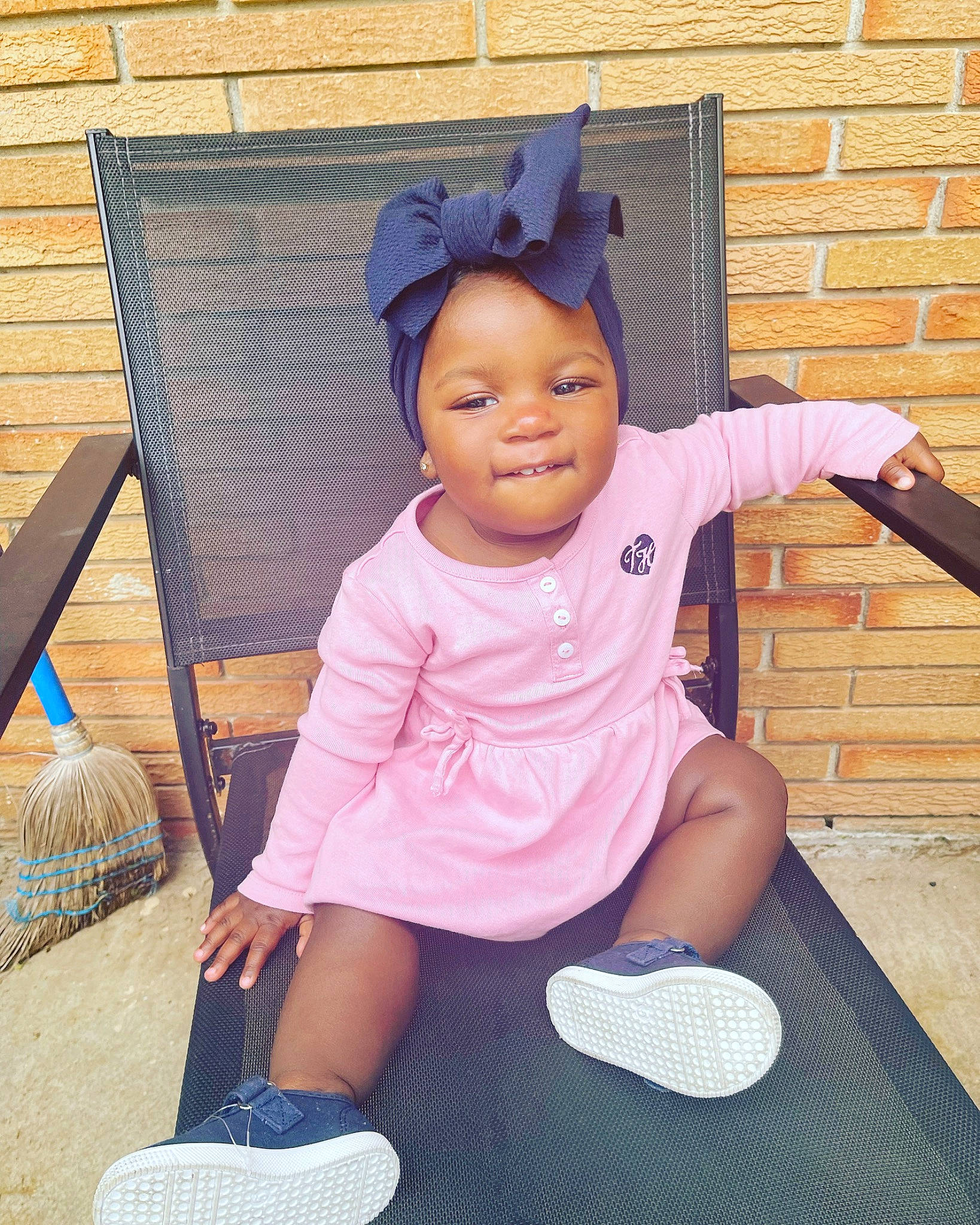 Paisley is registered to the contest to win money with this photo: baby, baby_toddler_clothing, blue, foot, fun, grass, happy, hat, leisure, magenta, outdoor_furniture, person, pink, purple, shorts, sleeve, smile, sneakers, sock, t_shirt