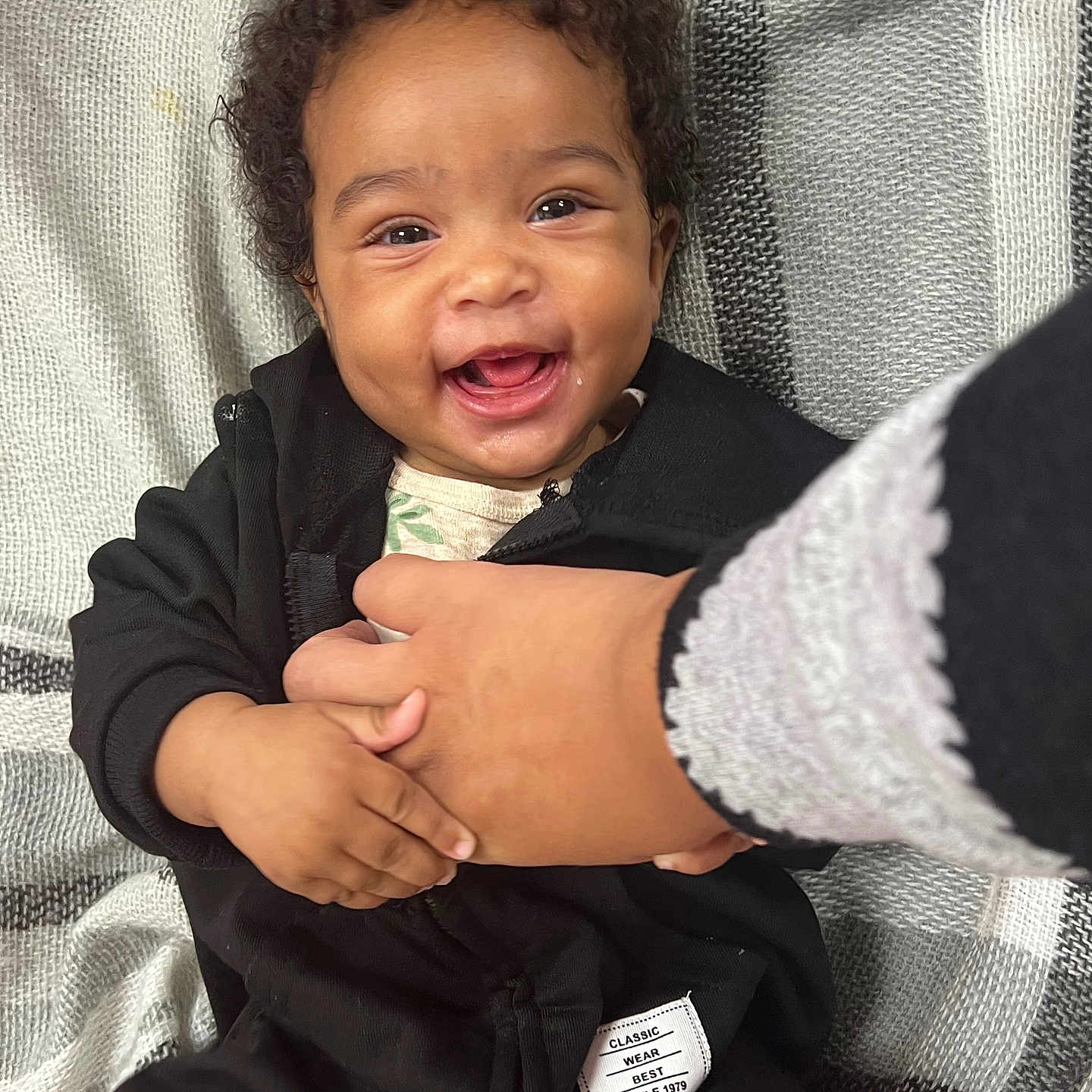 Kilania joined the competition — help win amazing prizes! baby, babylaughing, bodypart, clothing, coat, face, finger, hand, happy, head, jacket, knitwear, laughing, mouth, person, photography, portrait, smile, sweater, teeth