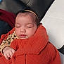 Renessmee joined the competition — help win amazing prizes! baby, sleeping, blanket, orange, headband, bow, hand, couch, black, white, peaceful, infant, cozy, face, closed_eyes, clothing, soft, resting, indoors, portrait