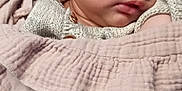 Renessmee joined the competition — help win amazing prizes! baby, sleeping, blanket, indoor, child, cozy, knitted_clothing, peaceful, face, head, wrapped, soft_texture, infant, cute, resting, portrait, closeup, warm, comfort, young